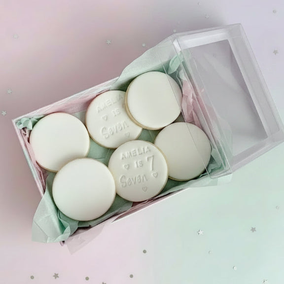 Personalised 7th birthday round white signature vanilla sugar biscuits. Each biscuit is embossed with the name.