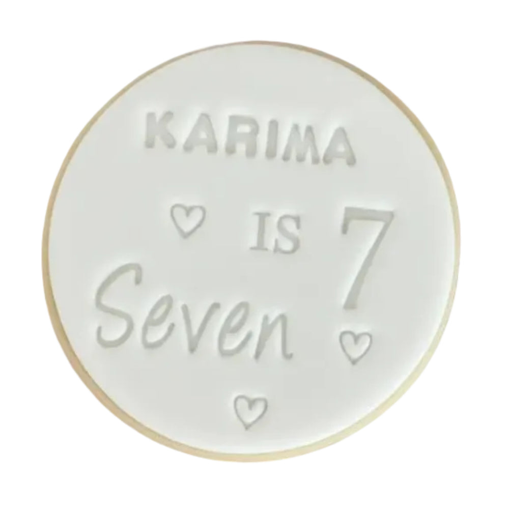 Personalised 7th birthday round white signature vanilla sugar biscuits. Each biscuit is embossed with the name.