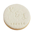 Personalised engagement round white signature vanilla sugar biscuit  embossed with a monogram design and the date.